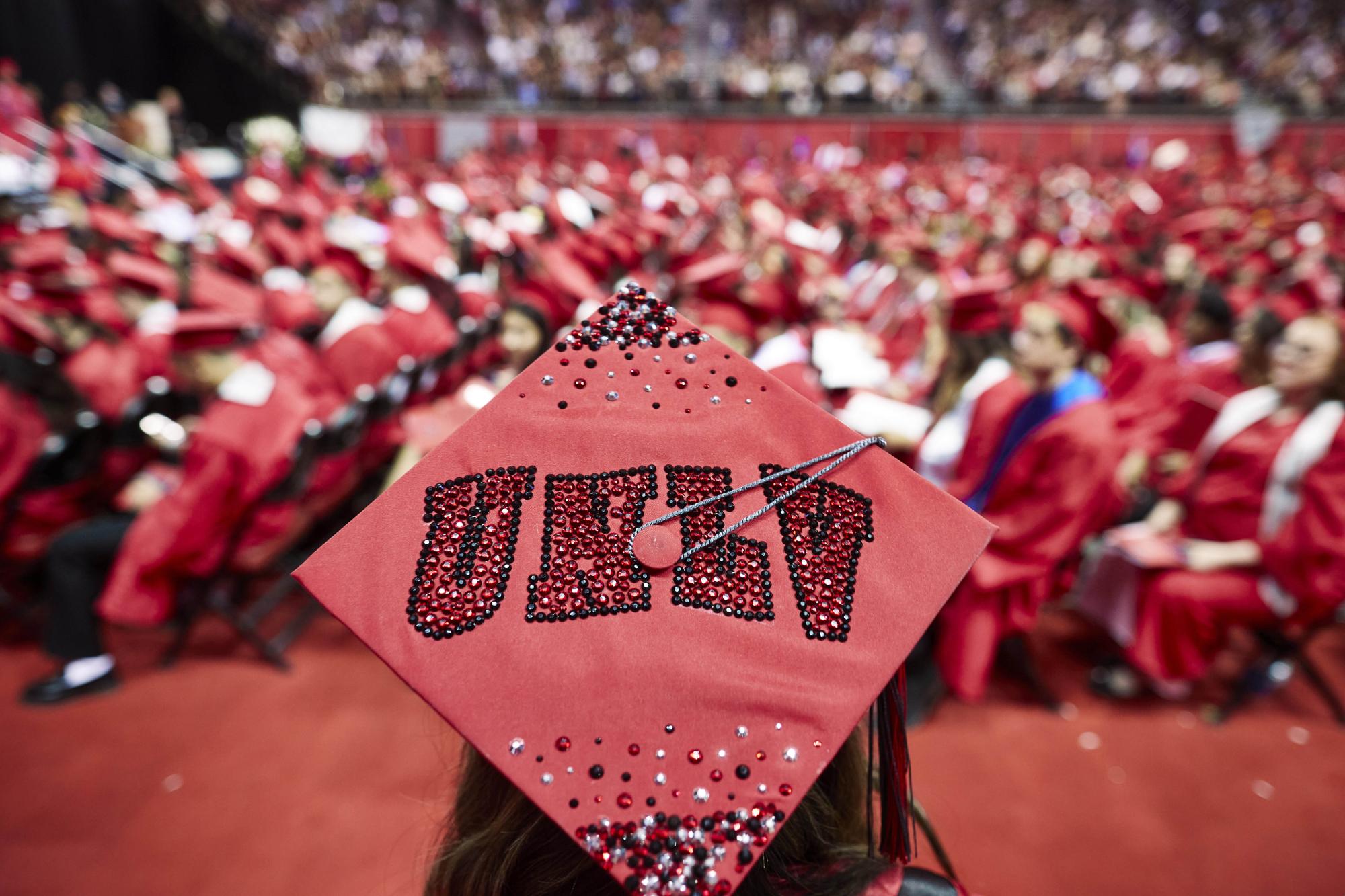 Graduation cap with red UNLV letters.