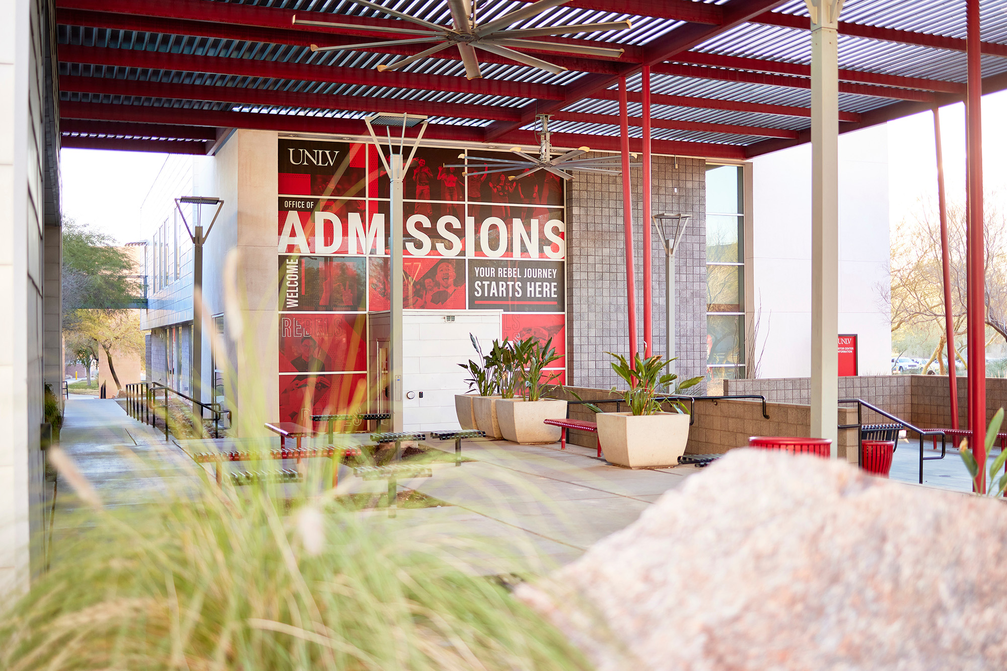 External wall of a building with a UNLV Office of Admissions mural displayed.