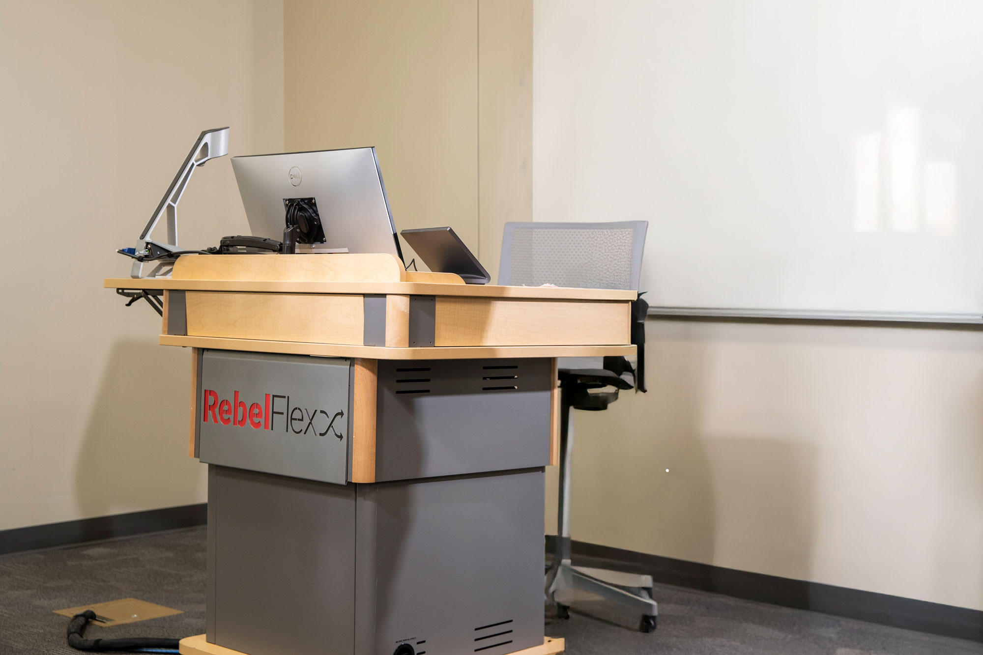 Lectern of a RebelFlex Room with the RebelFlex Logo