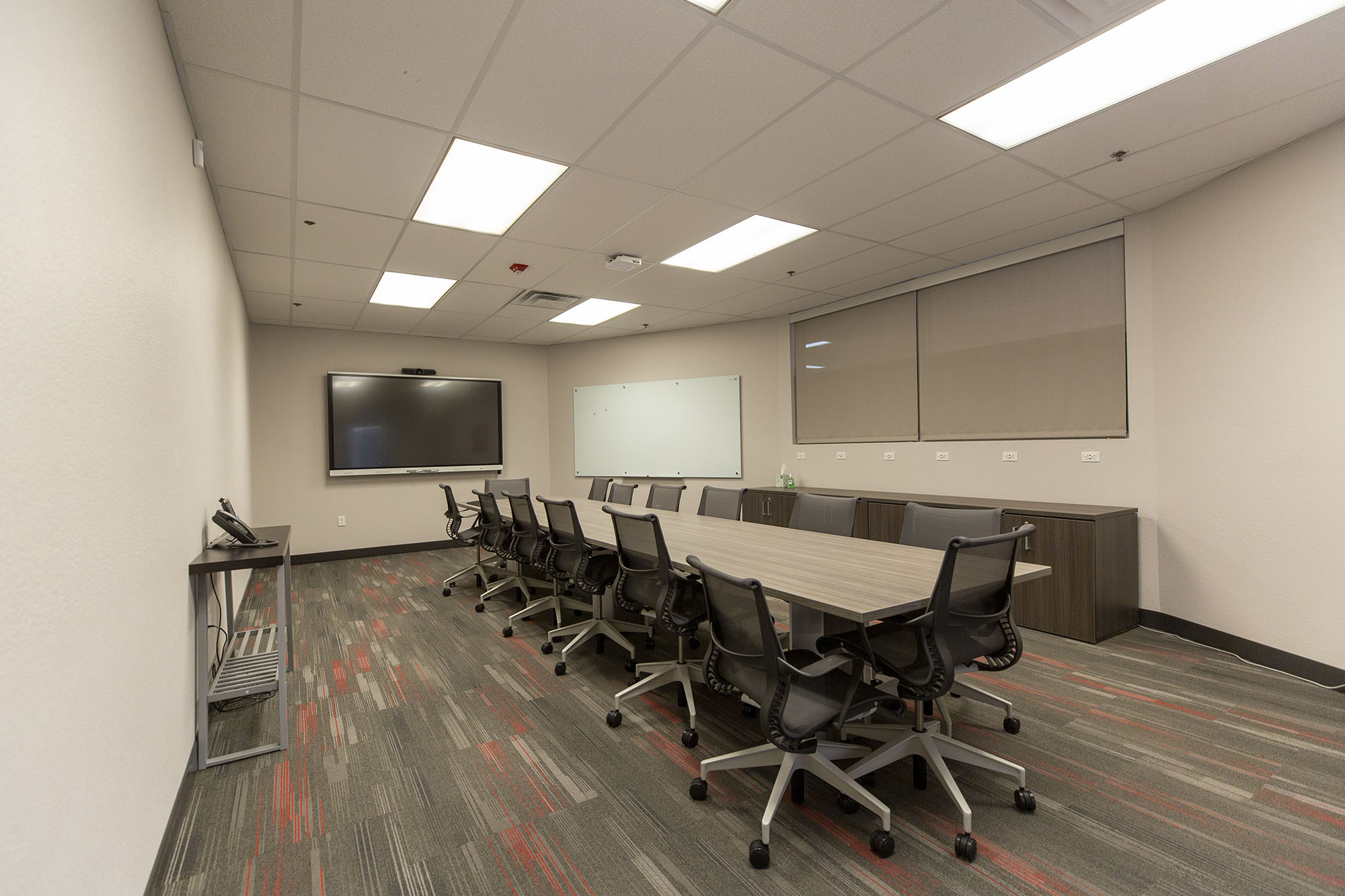 Wide view of a UNLV conference room and long table.