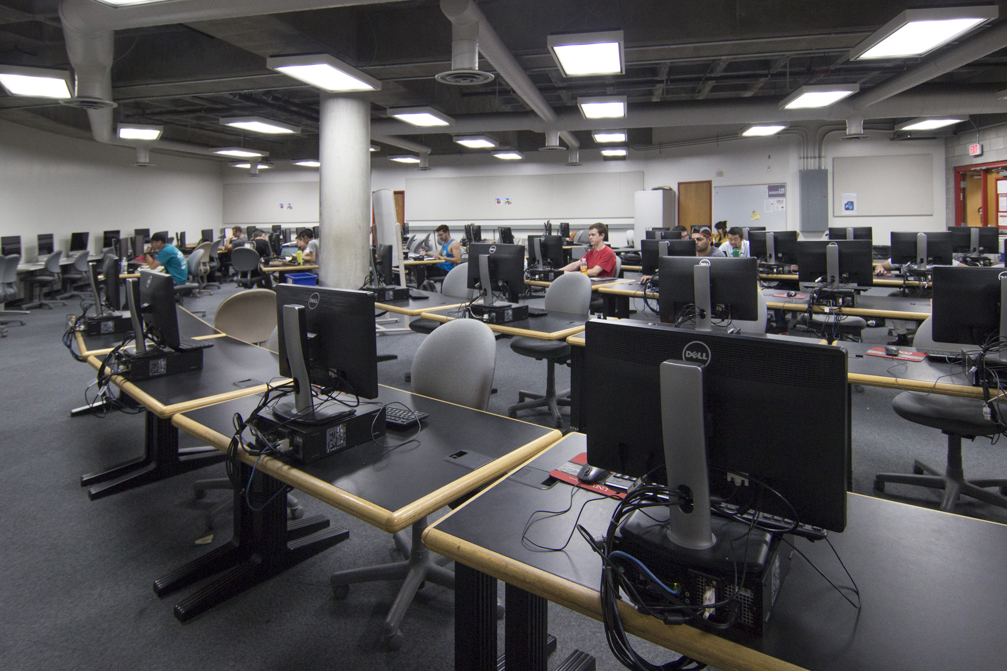Wide view of some students studying in a U-N-L-V computer lab.