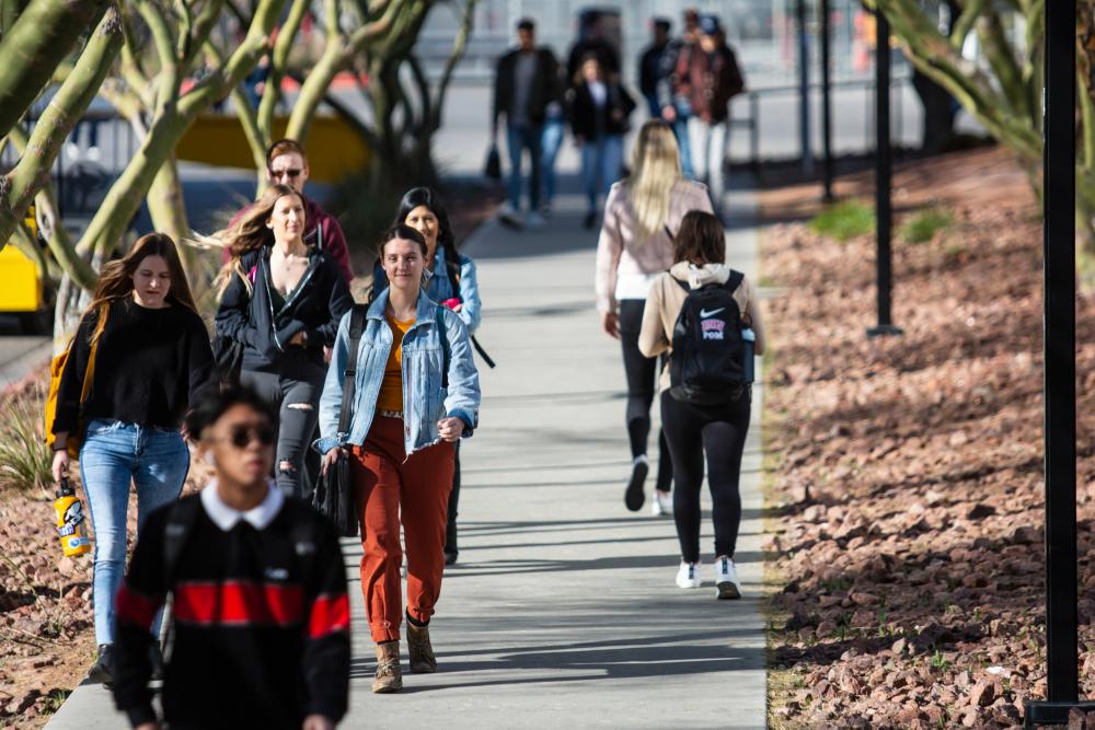 Group of students walking on campus. 