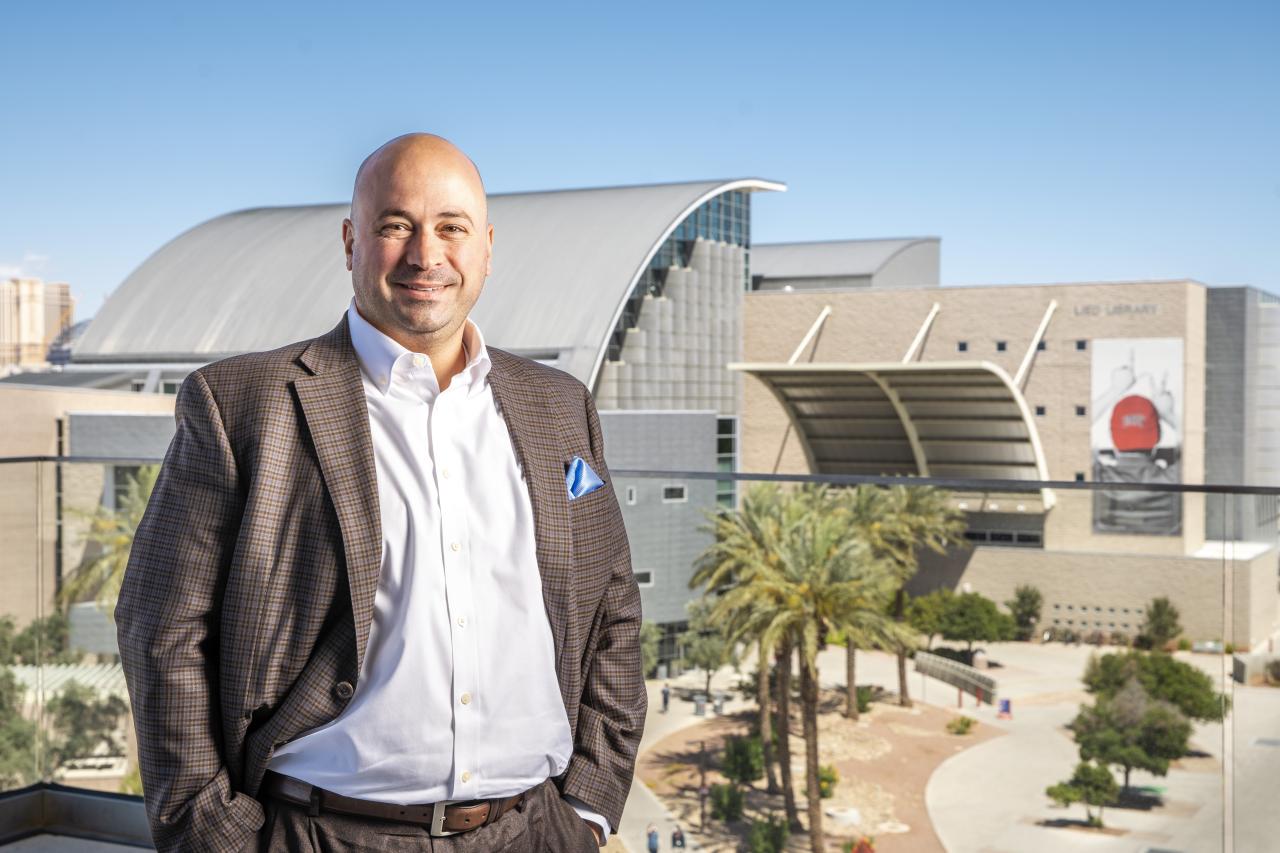Person standing with buildings in background