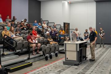 Michael Theil demonstrating visual technology inside AEB's Flexatorium. 