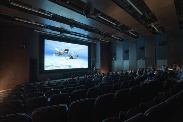 FDH theater with projector screen and Dolby Atmos sound experience.