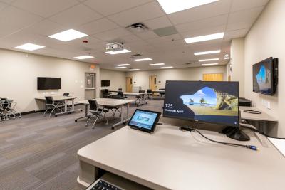 Desk with computer screen and touchpad