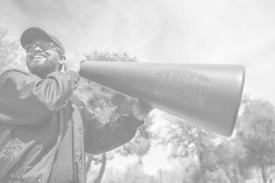 Person holding megaphone with UNLV on it