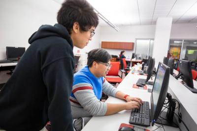 People using computer inside computer lab. 