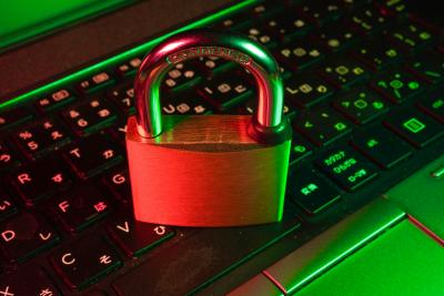 Padlock on top of computer keyboard.