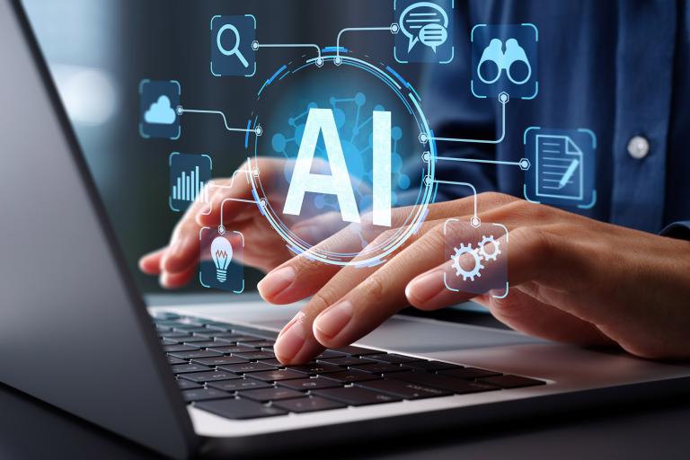 Hands typing on a laptop with a digital AI interface overlay.